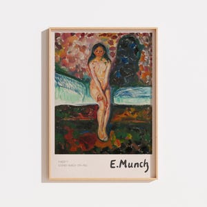 Peut inclure: Une impression d'art encadrée représentant la peinture Puberté d'Edvard Munch. L'œuvre montre une silhouette assise aux longs cheveux sombres sur un fond texturé et coloré. La marge inférieure contient le texte PUBERTY, EDVARD MUNCH 1894-1895 et E.MUNCH.