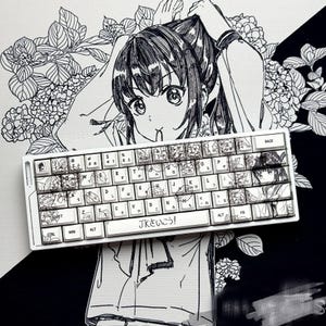 May include: White mechanical keyboard with custom keycaps featuring anime-style illustrations. The keyboard has Japanese characters and English letters. The image includes a black and white anime-style drawing of a girl.