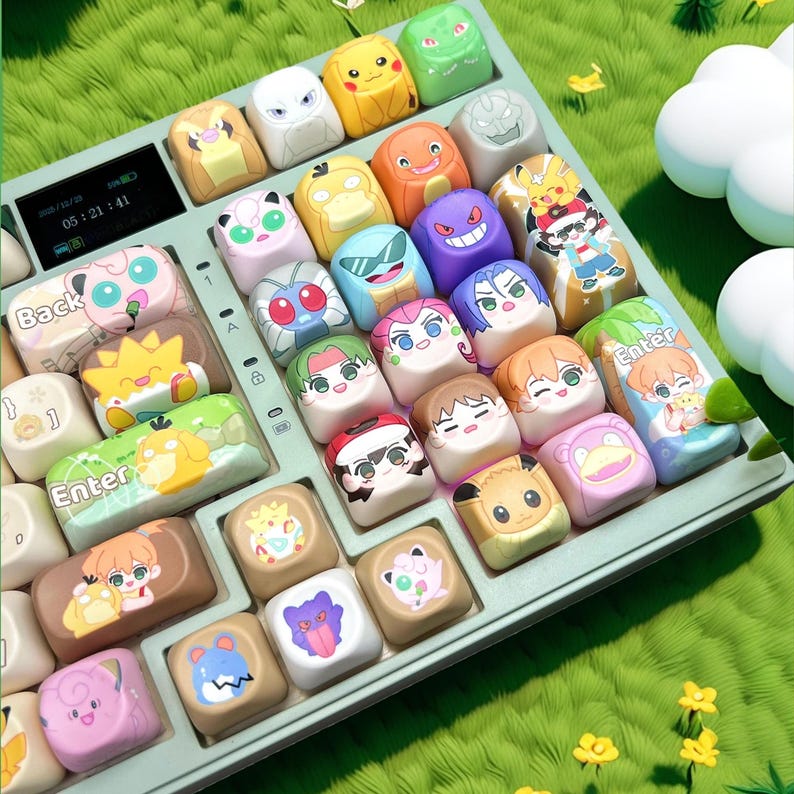 May include: A light green keyboard with custom keycaps featuring various cartoon characters. The keycaps are colorful and detailed, with designs including Pikachu, Jigglypuff, and other popular characters. The keyboard is set against a green, grassy background.