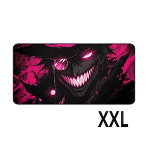 May include: A rectangular desk mat featuring a dark, stylized illustration of a grinning character with sharp teeth, a monocle, and a wide-brimmed hat. The design uses high-contrast black and vibrant magenta colors. The text XXL is printed below.