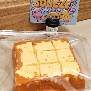 May include: A set of three ceramic mugs with a speckled, matte finish. The mugs are in shades of cream, light gray, and dark gray. Each mug has a simple, minimalist design, perfect for coffee or tea.