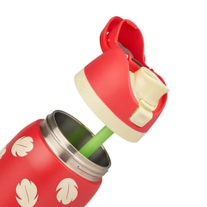 May include: A red insulated water bottle featuring a pattern of cream-colored leaf shapes. The bottle has a detachable red lid with a cream-colored mouthpiece and a green straw attached to the underside, extending into the open metal bottle neck.