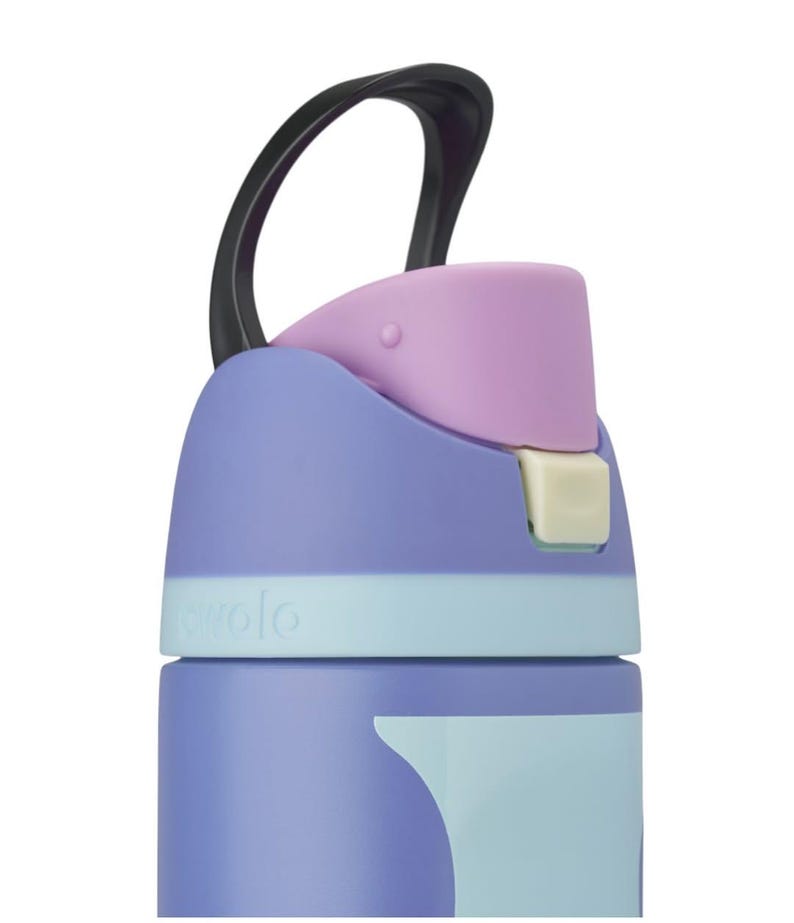 May include: A purple water bottle with a light blue band and a black carrying loop. The top features a light purple spout cover and a small cream-colored release button. The word Cirkul is embossed on the light blue band near the top section.