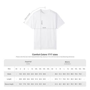 May include: A plain white t-shirt with a size chart diagram showing measurements for width, length, and sleeve length in inches for Comfort Colors 1717 sizes ranging from XS to 5XL, noting a manufacturing tolerance of plus or minus 1.5 inches.