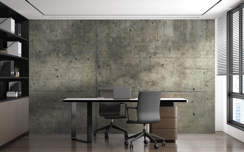 Peut inclure: Int&eacute;rieur de bureau moderne avec un mur en b&eacute;ton en arri&egrave;re-plan. Comprend un bureau blanc, deux chaises de bureau noires et un ordinateur portable. Un meuble en bois et une biblioth&egrave;que noire sont &eacute;galement visibles. La pi&egrave;ce a un design minimaliste.