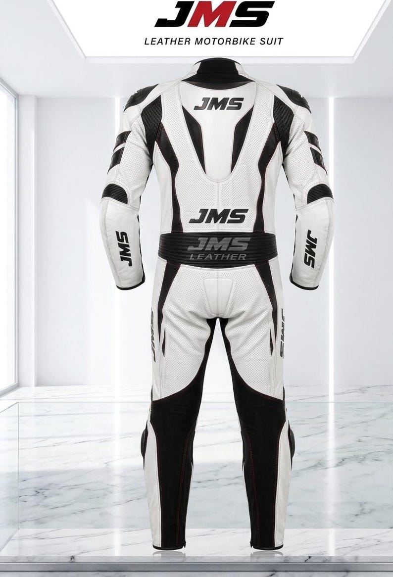 May include: A white and black leather motorbike suit featuring the JMS logo printed on the back, shoulders, and sleeves. The suit includes perforated leather panels, a high collar, and the text JMS LEATHER across the lower back section.