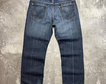 Jeans vintage Dolce & Gabbana con doppie tasche, modello ampio e scolorito, taglia 38 da uomo, stile anni 2000, gamba dritta e vestibilità comoda.