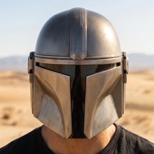 mandalorian helmet, beskar helmet replica, star wars helmet, mandalorian cosplay, bounty hunter helmet, wearable steel helmet, handmade helmet, metal cosplay helmet, mandalorian armor, sci fi helmet, cosplay prop helmet, comic con costume, larp helmet, collector helmet, screen inspired helmet, custom armor helmet, galactic warrior helmet, premium cosplay gear, fan collector gift, battle worn helmet,
