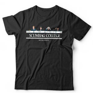 May include: A black short-sleeved t-shirt featuring a graphic print of four individuals above the text "VYVYAN", "PRICK", "NEIL", and "MIKH". Below this, the text "SCUMBAG COLLEGE" is printed in white, followed by the Roman numeral "MCMLXXXIV".