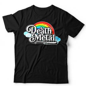 May include: A black short-sleeved t-shirt featuring a graphic print on the chest. The design displays the text "Death Metal" in a stylised white font, layered over a colourful rainbow arch and light blue clouds against a dark background.