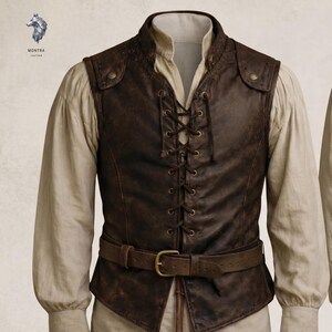 May include: A dark brown leather vest featuring a front lace-up closure with metal eyelets, a stand-up collar, and a matching leather belt with a brass-toned buckle. The vest is worn over a long-sleeved beige shirt. The logo Montra Leather is visible.