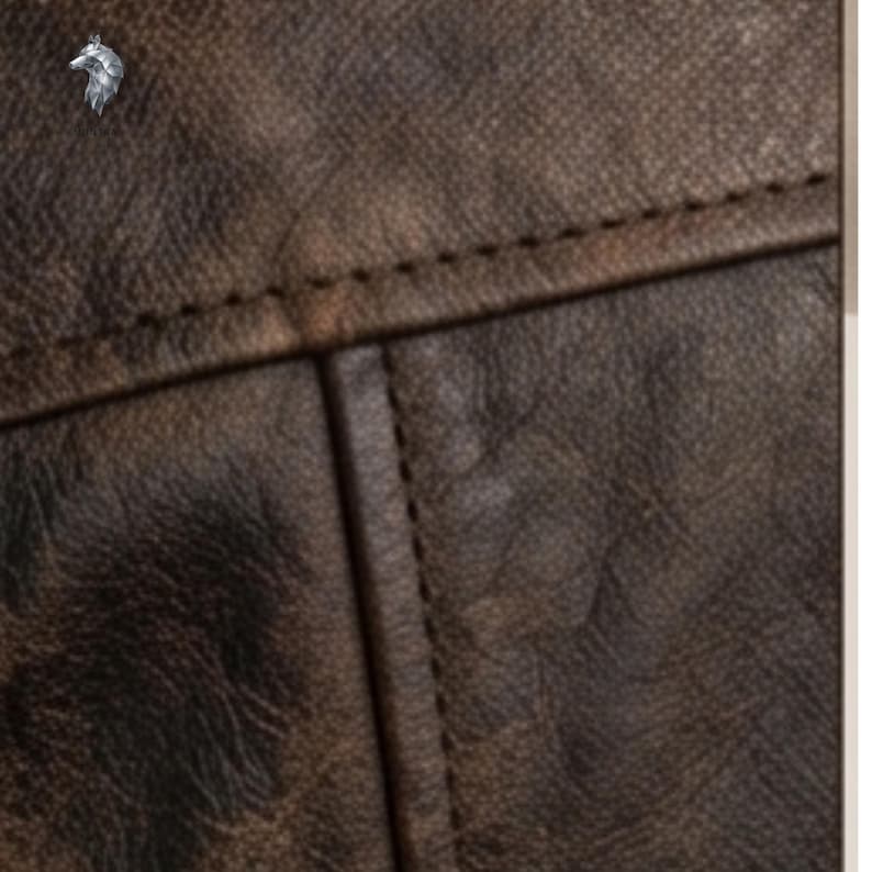 May include: A dark brown leather material with a distressed, textured surface and visible stitching along the seams. A small silver-colored wolf head logo is positioned in the upper left corner above the text that reads Wolfmark.