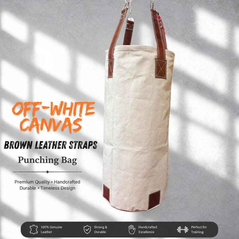 May include: Off-white canvas punching bag with brown leather straps, suspended from a metal chain. The image text reads "OFF-WHITE CANVAS, BROWN LEATHER STRAPS, Punching Bag".