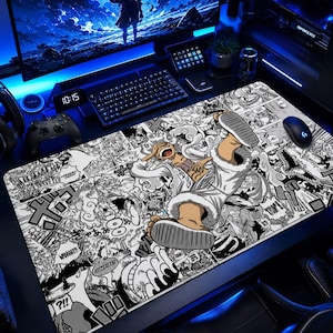 May include: A large rectangular mouse pad featuring a black and white manga-style illustration of a character in a white coat and gray shoes. The pad is surrounded by a gaming setup with a keyboard, monitor, and other accessories.