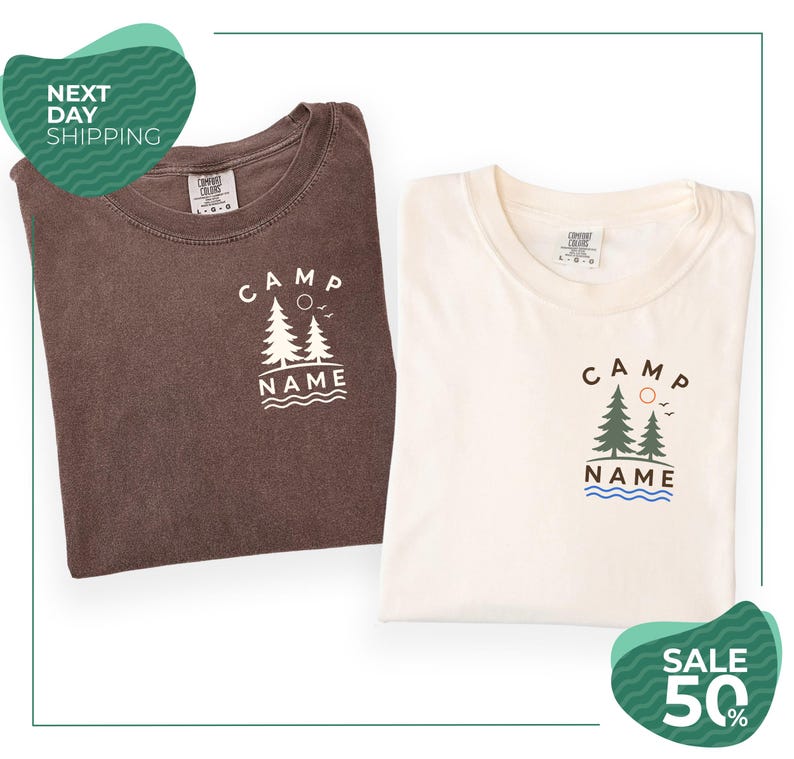 two t-shirts with the same design, one brown and one white, both featuring the text "CAMP NAME" and a graphic of trees. The brown t-shirt is folded, while the white t-shirt is unfolded. The image also includes text that reads "SALE 50%" and "NEXT DAY SHIPPING", suggesting that the t-shirts are on sale and can be ordered for the next day.
