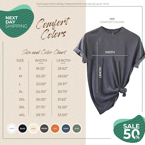 The image is a promotional advertisement for a clothing brand, featuring a gray t-shirt with measurements and color options. The ad highlights the brand's comfort colors and offers a 50% discount on their next day shipping.