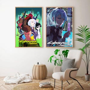 May include: Two framed Cyberpunk: Edgerunners anime posters. One features a group of characters with weapons, the other a woman with blue hair. Both posters have the show's title in a stylized font. The posters are displayed in a room with a chair and plants.