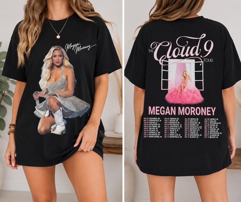 May include: Black t-shirt featuring a graphic of a woman in a silver dress and white boots. The front of the shirt has the text "Megan Moroney" in cursive. The back of the shirt has the text "The Cloud 9 Tour" and a list of tour dates.