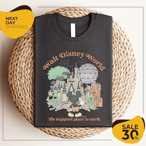 A t-shirt with a graphic design depicting various Disney landmarks and elements, including Mickey Mouse and the Eiffel Tower, along with the text "Walt Disney World" and "The Happiest place in earth".