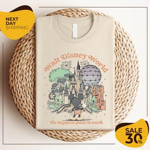 A t-shirt with a graphic design depicting various Disney landmarks and elements, including Mickey Mouse and the Eiffel Tower, along with the text "Walt Disney World" and "The Happiest place in earth". The t-shirt is displayed on a woven basket, and there are two yellow sale signs indicating a 30% discount.