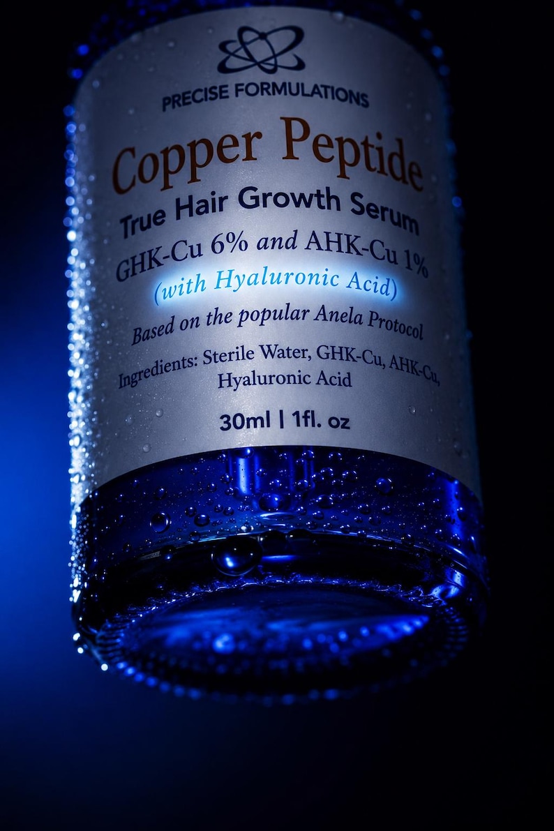 May include: A cylindrical bottle of Precise Formulations Copper Peptide True Hair Growth Serum with GHK-Cu 6% and AHK-Cu 1% with Hyaluronic Acid. The label lists ingredients as Sterile Water, GHK-Cu, AHK-Cu, Hyaluronic Acid. Volume is 30ml | 1fl. oz.