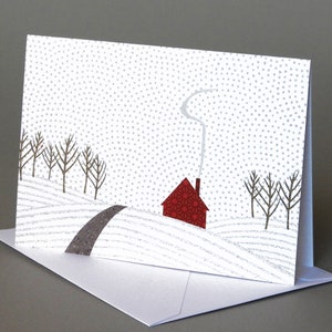 May include: A red house with a white chimney and smoke coming out of it sits on a snowy hill. The house is surrounded by trees and a winding road. The background is a white snowy sky with a subtle gray dot pattern.