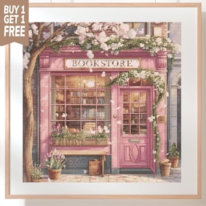 May include: A cross-stitch pattern depicting a pink bookstore storefront with a large window, a glass-paned door, and a wooden bench. The shop is adorned with white flowering vines and potted plants, with the word BOOKSTORE printed above the window.