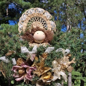 Handcrafted rustic angel with lights and vintage flowers, trims