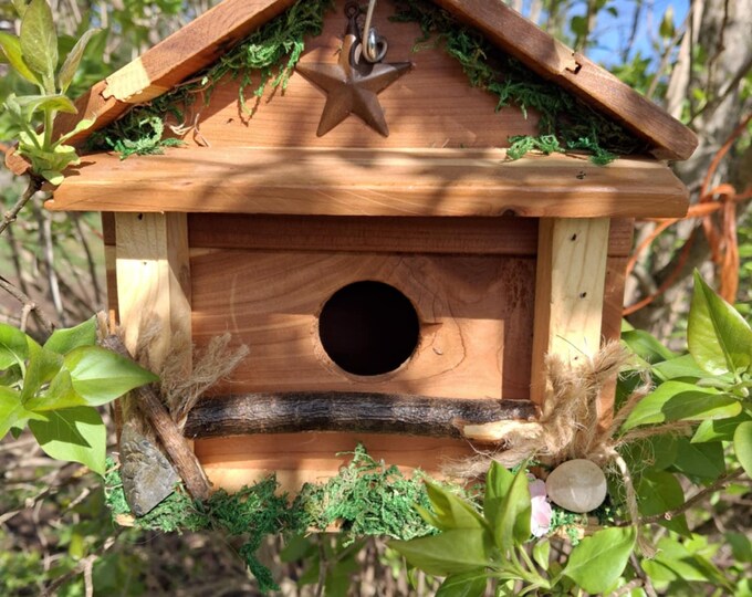 Rustic handcrafted cedar country birdhouse with rusty tin star and cleanout area