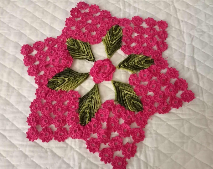 Handmade vintage crocheted rose with leaf doily