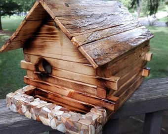 Reclaimed log birdhouse with built in feeder