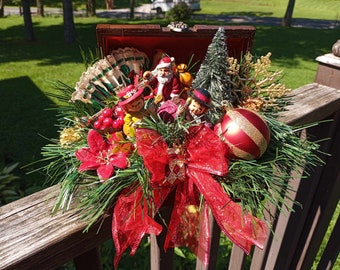 Christmas chest with ornaments and greenery tabletop or shelf decoration