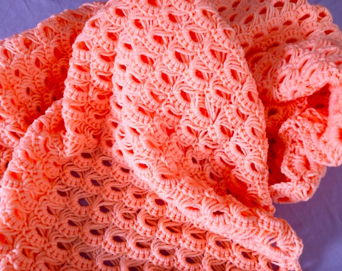 Hand crocheted peach baby afghan