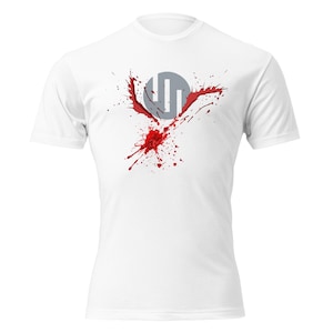 May include: White t-shirt featuring a gray circle with three vertical lines and red splatter design. The graphic is centered on the chest. The shirt has short sleeves and a crew neck.
