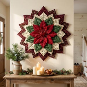 May include: A quilted fabric poinsettia wall hanging featuring layered petals in shades of deep red, forest green, and cream with a botanical print. The center is adorned with small red spheres, creating a star-shaped floral design.