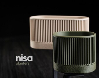 a set of two modern minimalist planters, where clean lines meet textures