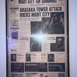 May include: A framed newspaper print titled Night City Chronicle, dated Tuesday, December 7, 2077. The front page features the headline Arasaka Tower Attack Rocks Night City, accompanied by various articles, black and white images, and advertisements.