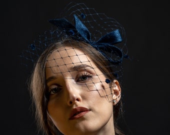 Navy bow fascinator with veil, women bow fascinator in navy, wedding guest headpiece with dotted veil