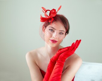 Poppy red feather fascinator with birdcage veil, red wedding guest feather headpiece with veil in various colours