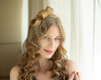 Understated gold women fascinator with beige birdcage, gold wedding guest fascinator, modern couture millinery headpiece