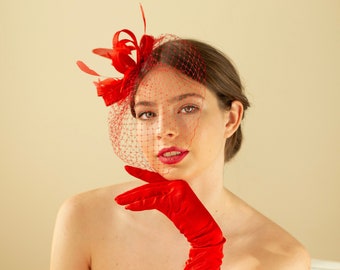 Poppy red feather fascinator with birdcage veil, red wedding guest feather headpiece with veil in various colours