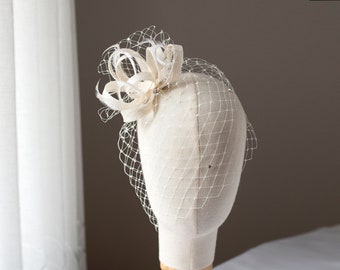 Bridal feather fascinator with rhinestone birdcage, romantic wedding hairpiece with rhinestone veil for a bride, elegant feather headpiece