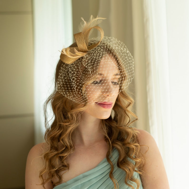 Gold fascinator with beige feathers and birdcage veil, gold wedding guest fascinator, modern millinery headpiece image 3