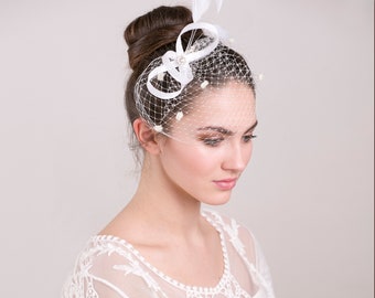 Bridal fascinator with dotted birdcage blusher, feather hairpiece for wedding, understated feather headpiece