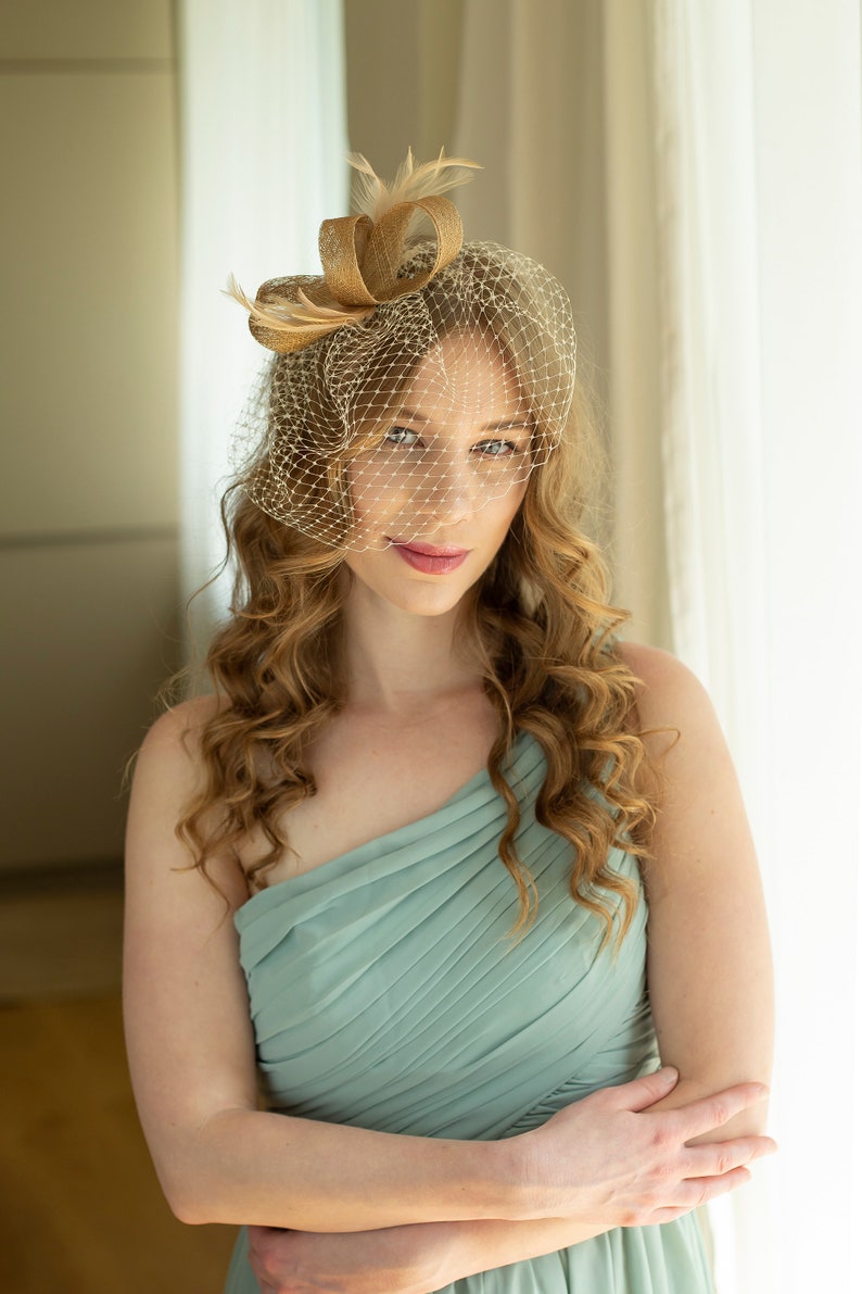 Gold fascinator with beige feathers and birdcage veil, gold wedding guest fascinator, modern millinery headpiece image 4
