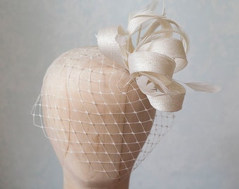 Bridal feather fascinator with birdcage veil, birdcage with millinery fascinator