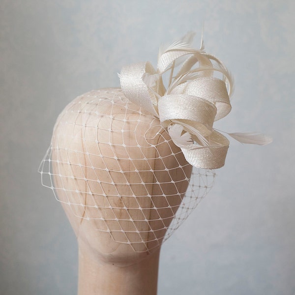 Bridal feather fascinator with birdcage veil, birdcage with millinery fascinator