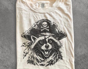 Retro Pirate Raccoon Graphic Tee, Funny Woodland Animal Shirt, Vintage Adventure Style Top, Comfort Colors® Novelty Gift Tee