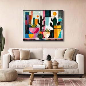 a living room with a white couch and a painting on the wall