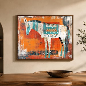 May include: A framed wall art print featuring a stylised donkey in white and teal with geometric patterns on its back. The animal is set against a vibrant, textured orange background with visible brushstrokes and distressed paint effects.